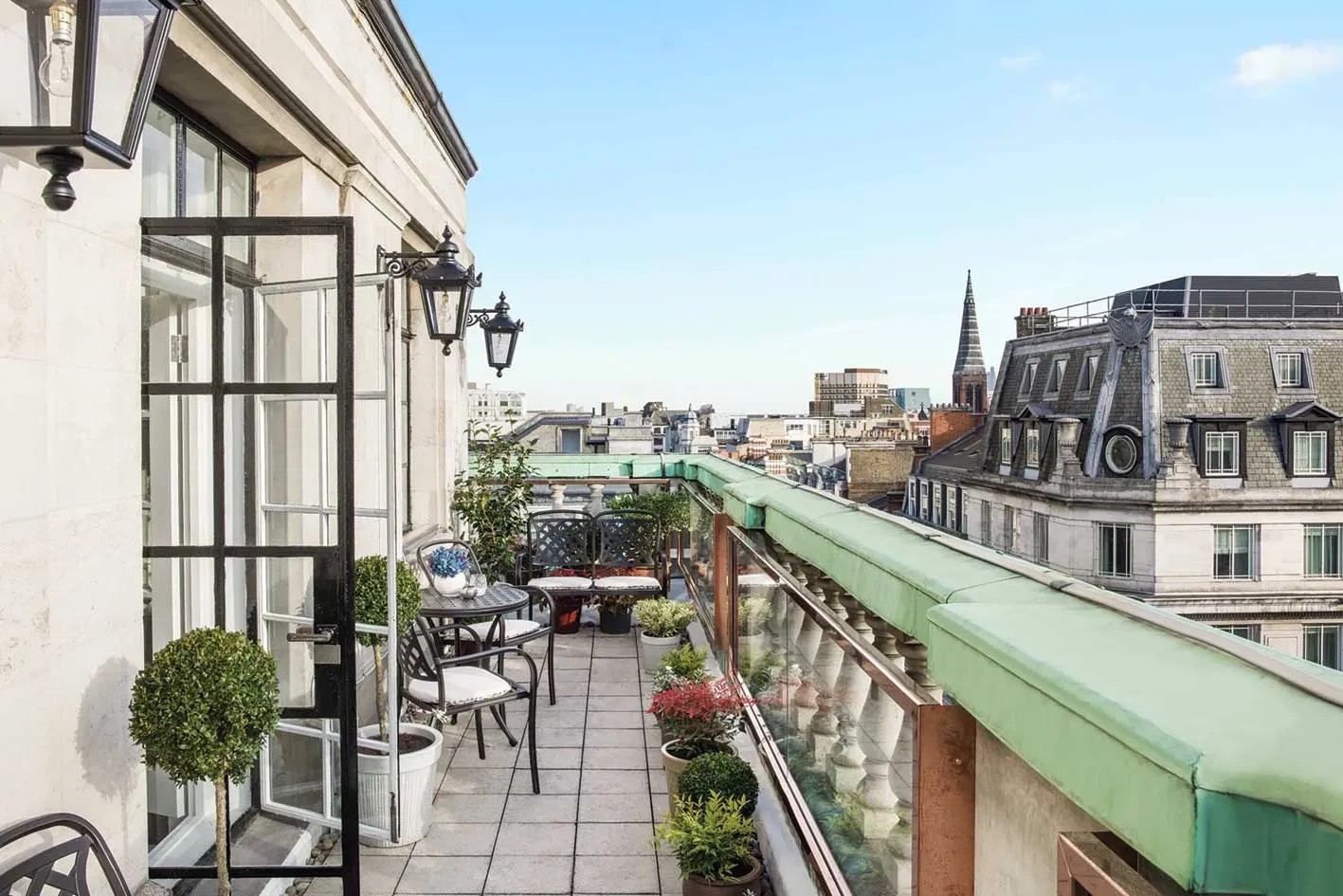 Hotel terrace overlooking elegant city rooftops