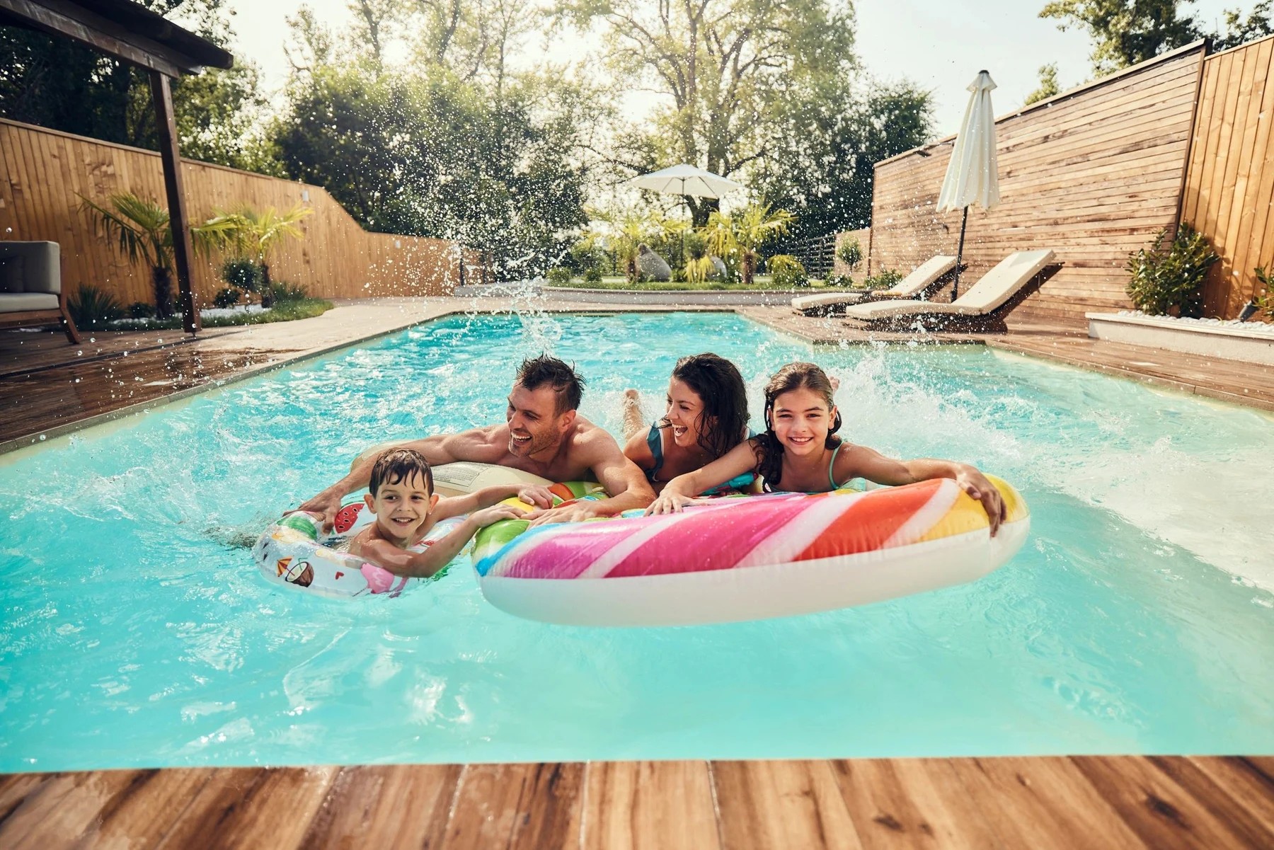 Family enjoying time together in a resort pool