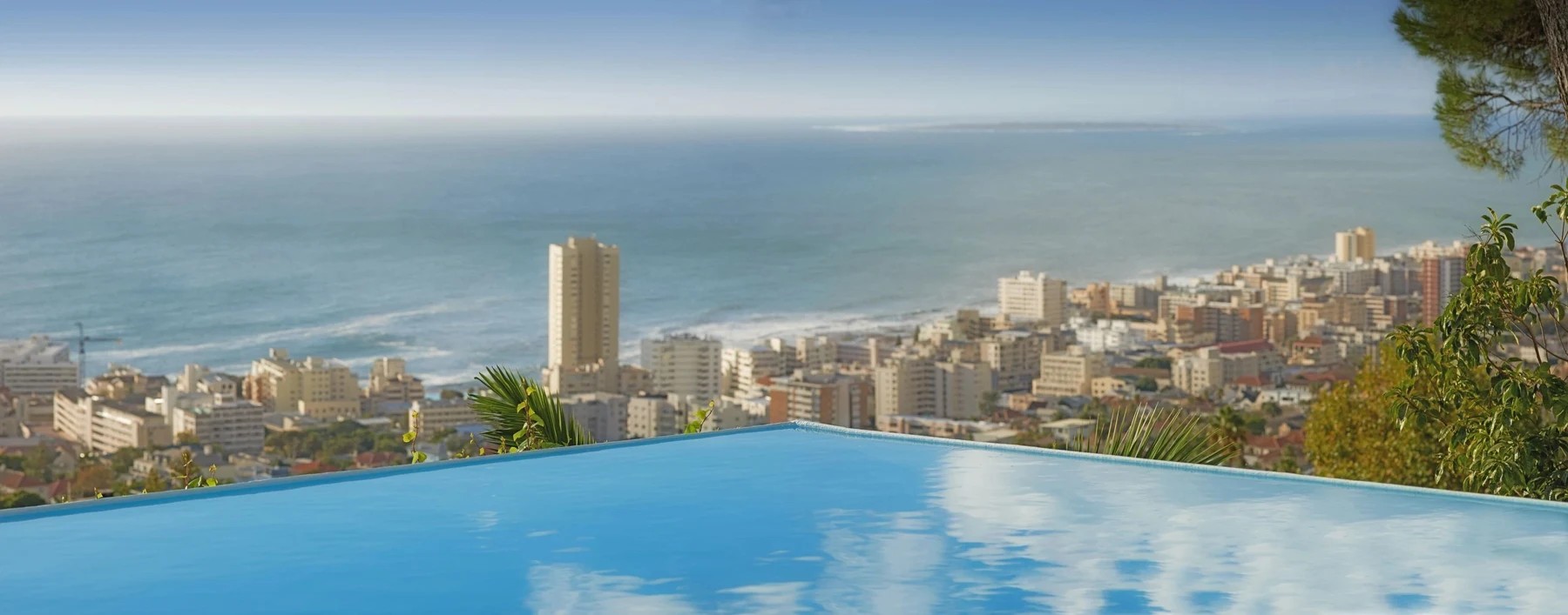 Infinity pool overlooking a coastal city