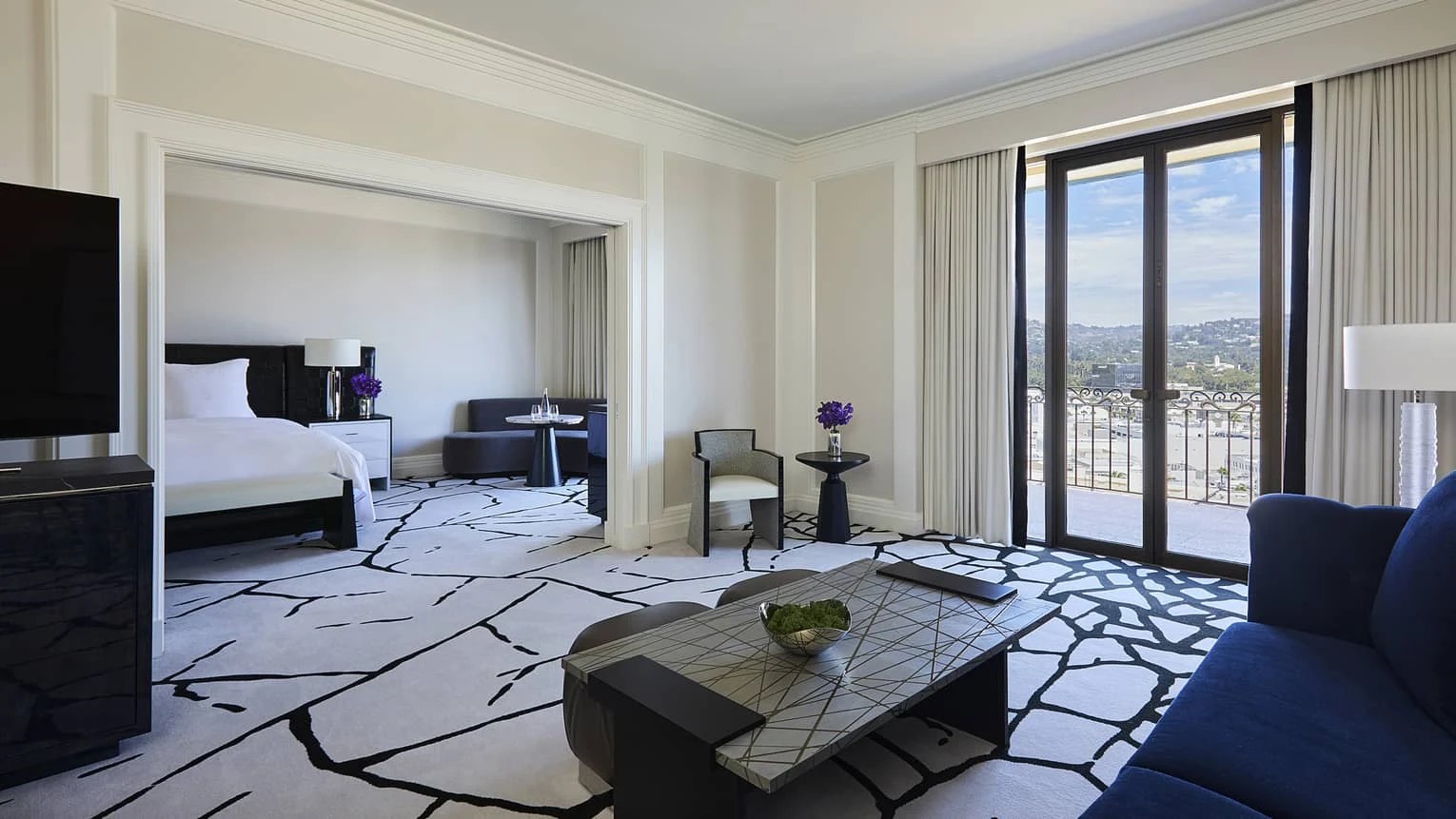 Spacious luxury hotel suite with a private balcony