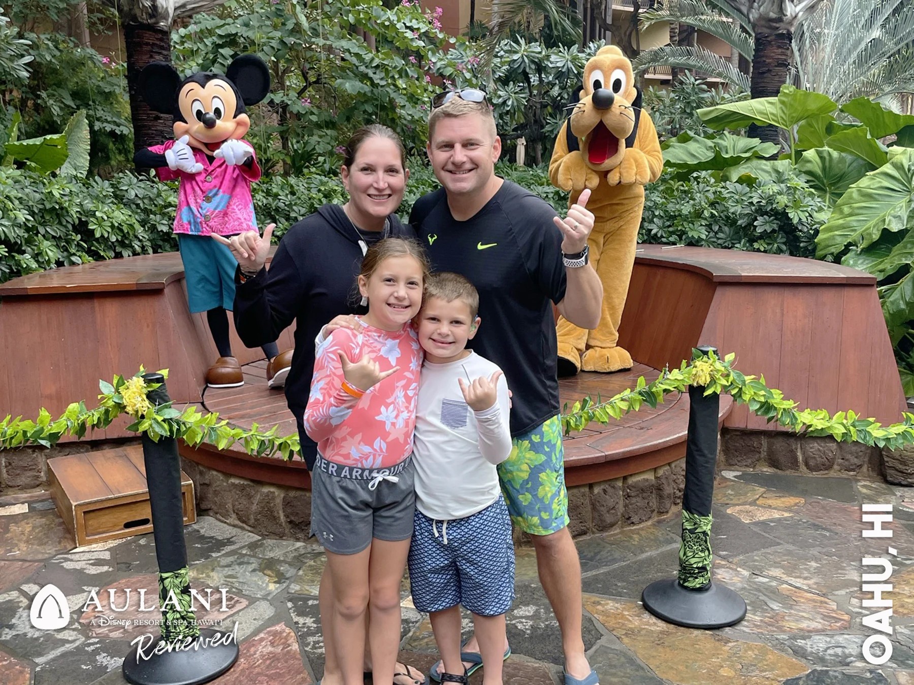 Blake and his family with Disney characters during a resort visit