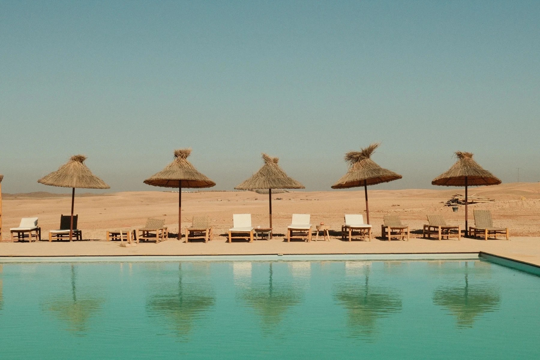 Luxury resort pool with cabanas