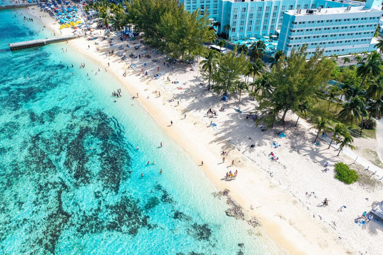 White-sand beach beside turquoise water in Nassau, Bahamas